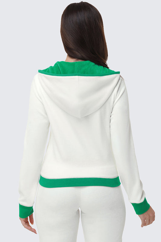 A person with long dark hair is seen from the back, wearing the Contrast Trim Logo Hoodie, which features green hood lining, cuffs, and waistband—a sporty everyday layer—paired with matching white pants.
