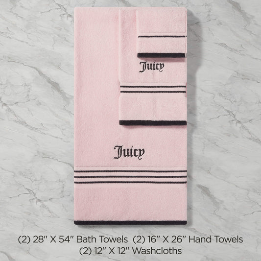 The Neon Border Bath Towel Set features two plush pink bath towels, two hand towels, and two washcloths with black stripes and "Juicy" embroidered in black, shown on a marble background with sizes detailed below.