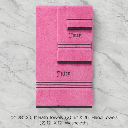 The Neon Border Bath Towel Set includes two pink bath towels, two hand towels, and two washcloths with black stripes and Juicy embroidery, all arranged on a light marble surface. Sizes listed below.