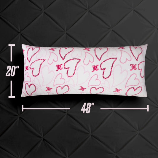 The Plush Body Pillow, measuring 20 x 48 inches, is rectangular and white with pink and red hearts plus MC initials, resting on a black textured surface. This oversized pillow brings a stylish accent to any space.