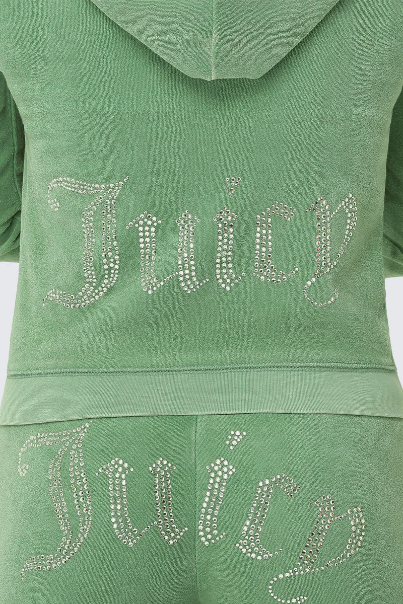 Close-up of the Big Bling Washed Terry Hoodie, a green velour tracksuit with a sparkling rhinestone "Juicy" logo on the back, paired with a cozy hoodie for ultimate comfort.