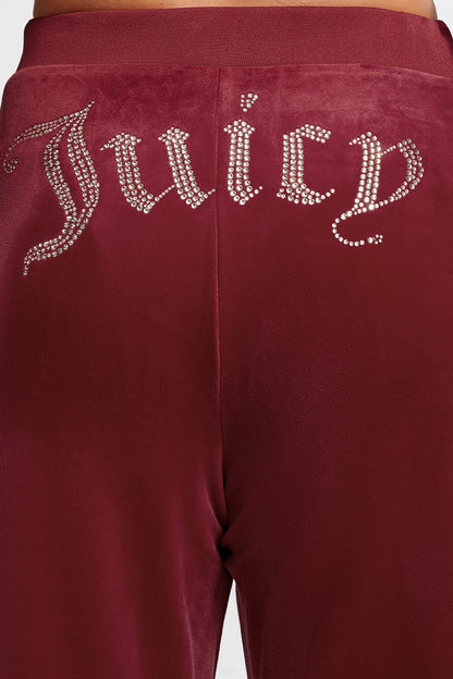Close-up of the back of the Plus-Size OG Big Bling Velour Track Pants featuring a sparkling rhinestone Juicy embellishment across the waistband.