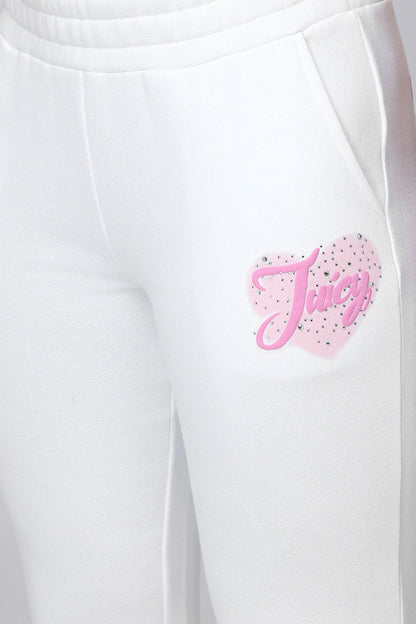 Close-up of the Sweetheart Fleece Sweatpants with pockets, showcasing a pink heart graphic and Juicy in cursive on the left hip—designed for a relaxed fit.