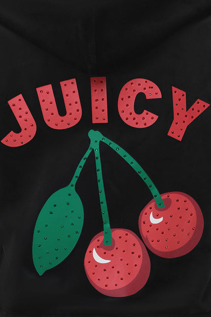 The Cherry Bling Velour Hoodie showcases a rhinestone JUICY cherry graphic with sparkling cherries and bold red lettering, highlighting its playful style on a sleek black, short-sleeve velour hoodie.