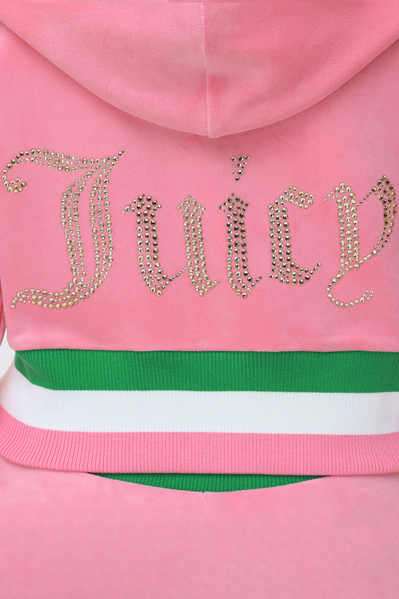 A close-up of the back of the Heritage Stripe Bling Velour Zip Hoodie in pink, featuring "Juicy" in gold rhinestones above a green, white, and pink striped waistband.