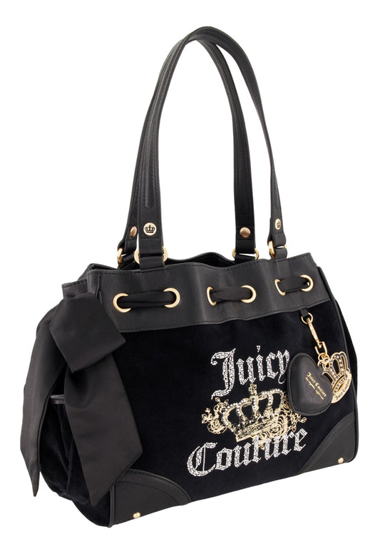 The black Royal Bloom Daydreamer Tote Bag by Juicy Couture features gold accents, a large side bow, an embroidered crown logo, and a gold keychain with heart and crown charms—ideal for adding signature Juicy style to any outfit.