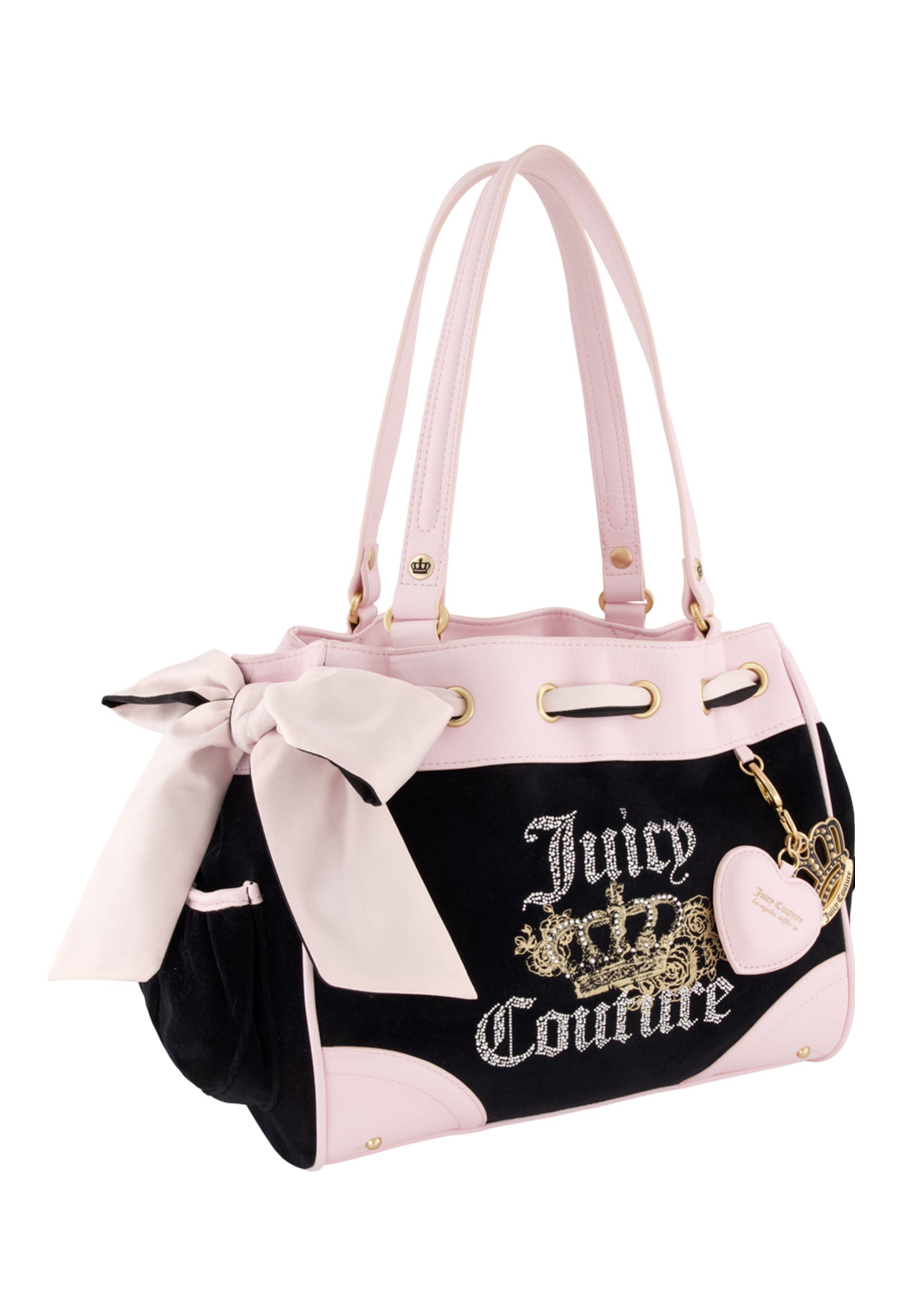 The Royal Bloom Daydreamer Tote Bag features a black and pink design, double handles, a large side bow, gold logo with crown, and heart-shaped keychain—blending playful charm and luxury in a spacious statement tote.