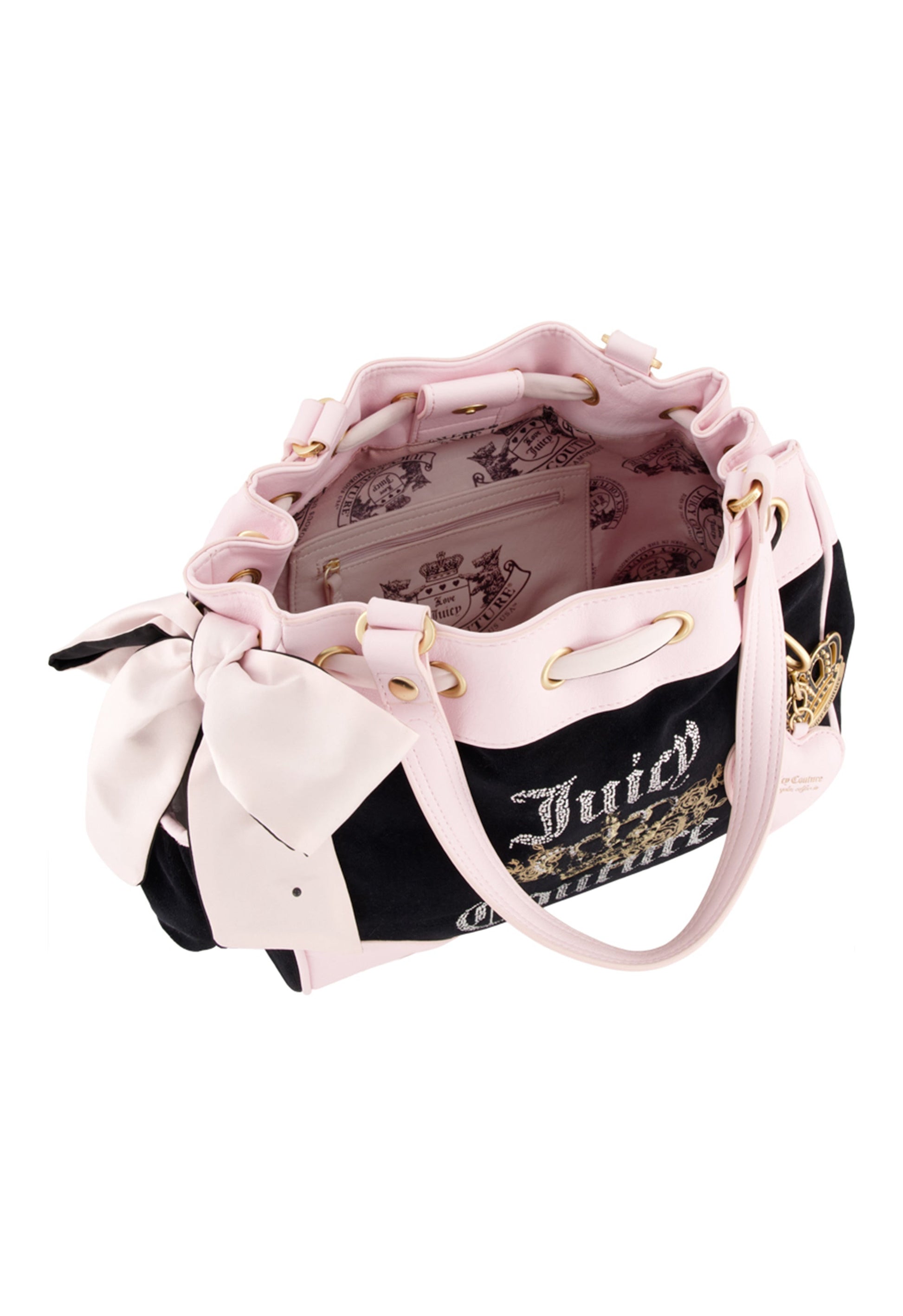 The Royal Bloom Daydreamer Tote Bag is black and pink with gold accents, a large side bow, open top showing a pink crown-and-crest interior, dual handles, and a drawstring closure for style and spaciousness.