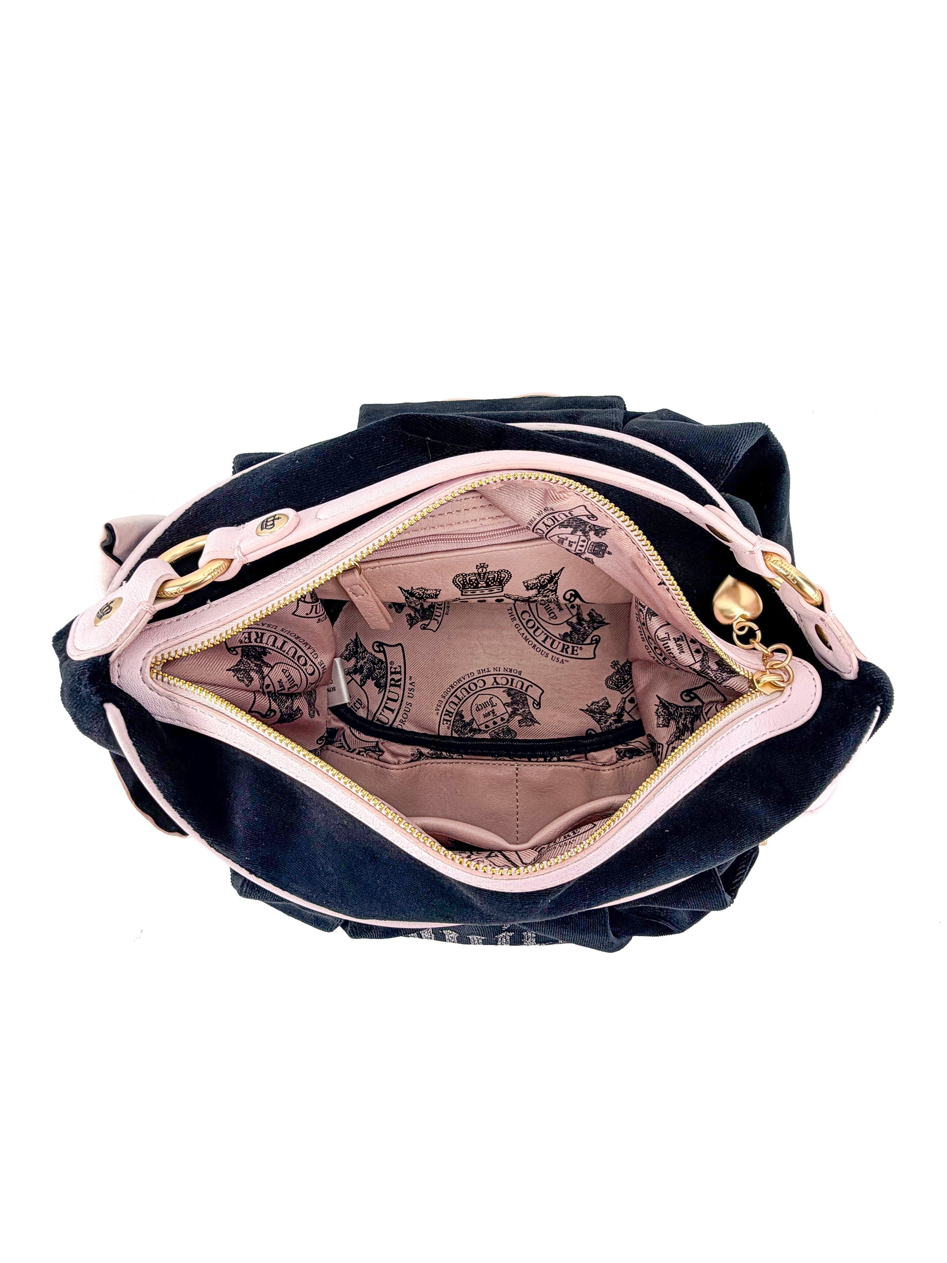 Top view of the Royal Bloom Hobo Bag, an everyday accessory with a light pink interior featuring black printed details, an inner zippered pocket, and gold-toned hardware on a stylish black and pink exterior.
