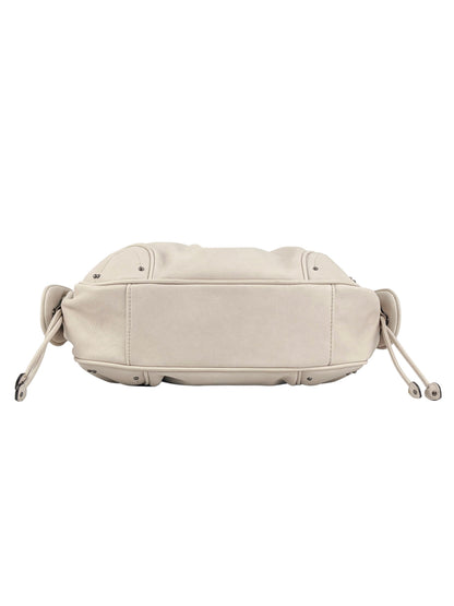 A beige leather Vintage Vibes Satchel Bag shown from the bottom, featuring drawstring details on both sides and visible edge stitching for a touch of throwback glamour.