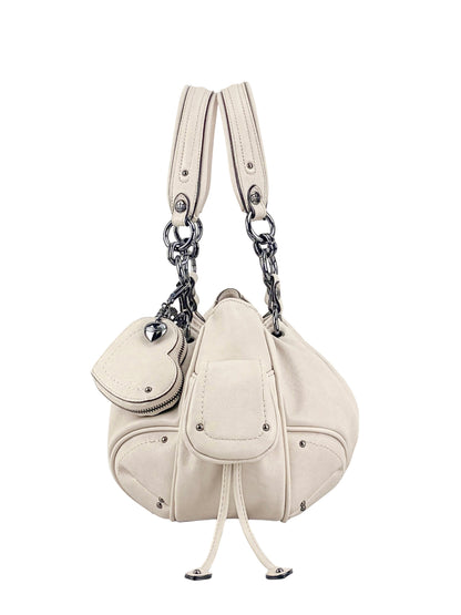 The Vintage Vibes Satchel Bag is cream-colored leather with metal hardware, dual handles, decorative stitching, a front pocket with flap and drawstring, plus a matching coin pouch attached by a chain for retro style.
