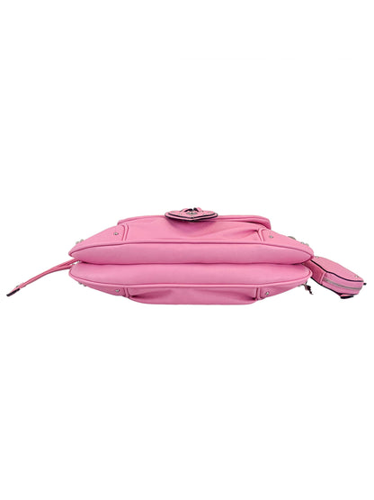 The Vintage Vibes Hobo Bag in pink features a side profile, flap closure, and a small zippered pouch on the strap—ideal for fans of stylish handbags with vintage charm.