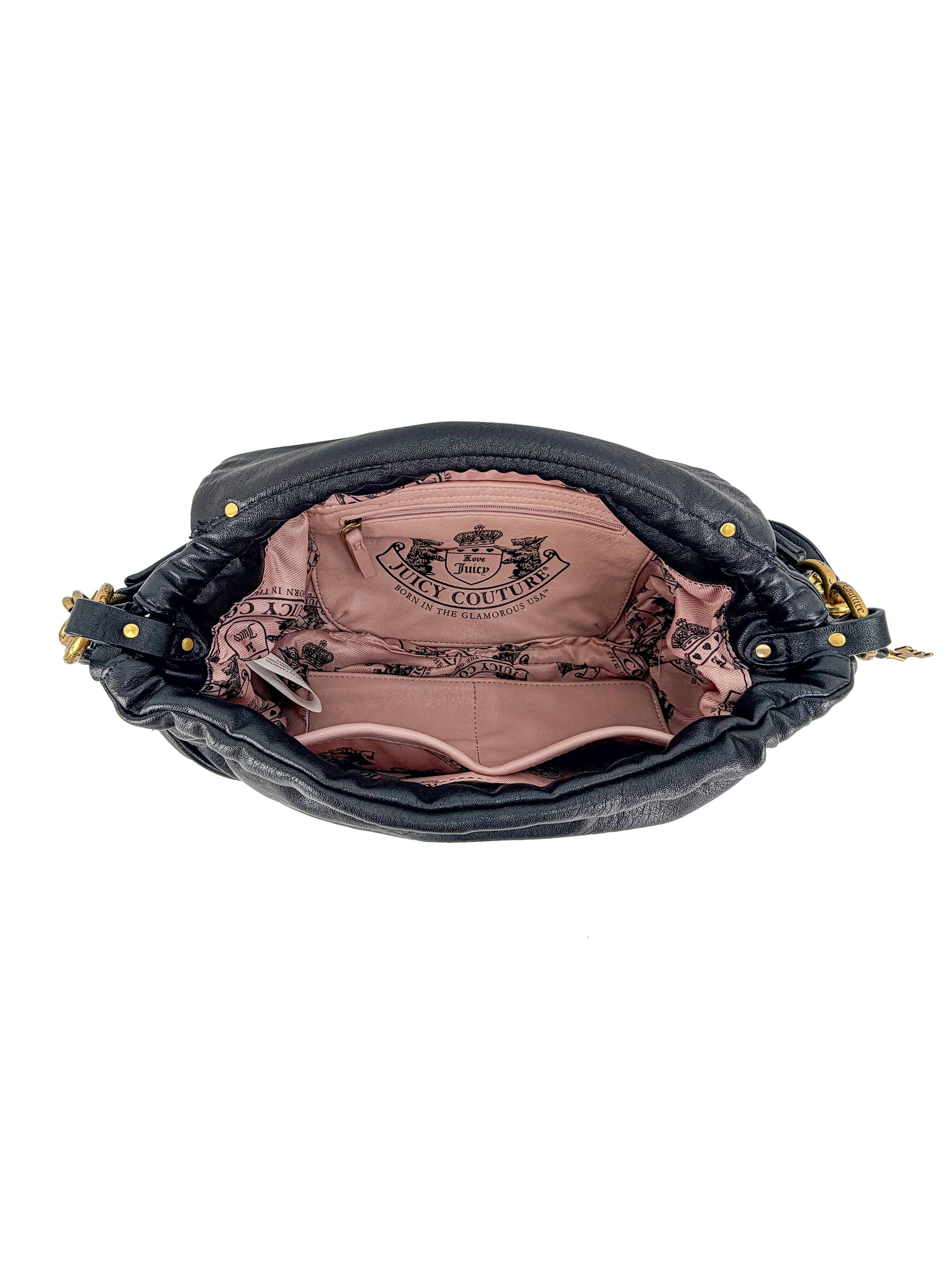 The black leather Vintage Vibes Hobo Bag features a pink fabric interior with pockets and Juicy Couture logo, plus gold hardware on the sides for a stylish touch.