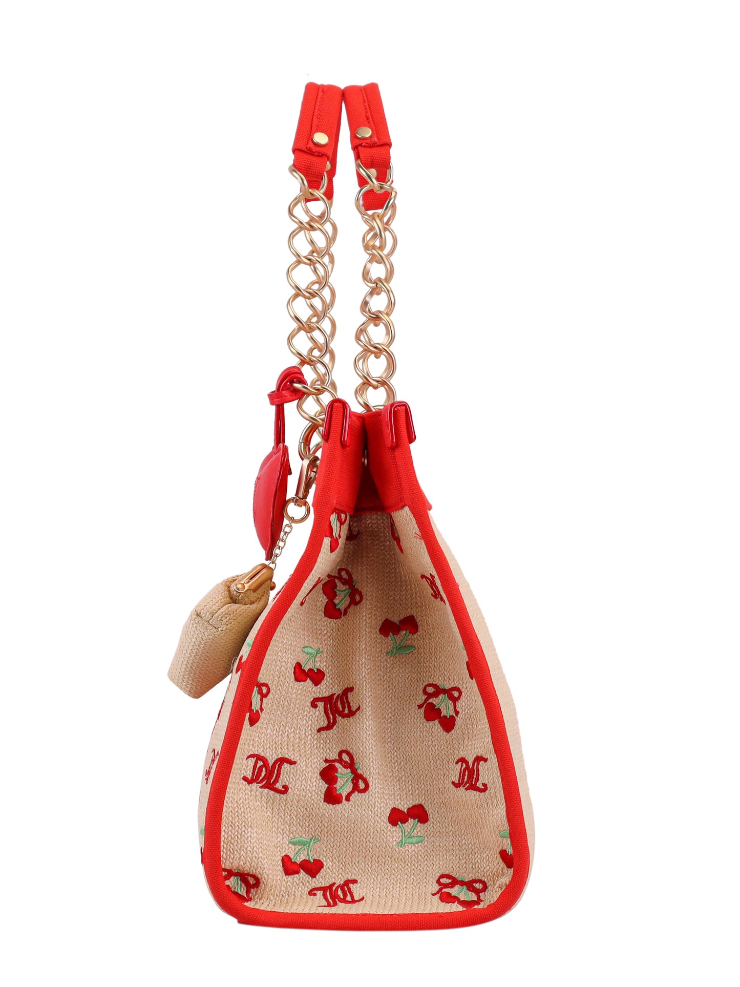 Side view of the Cherry Pop Item Tote Bag—a Juicy beige handbag with red trim, gold chain handles, red cherry and logo patterns, and an attached small beige pouch, perfect for everyday use.