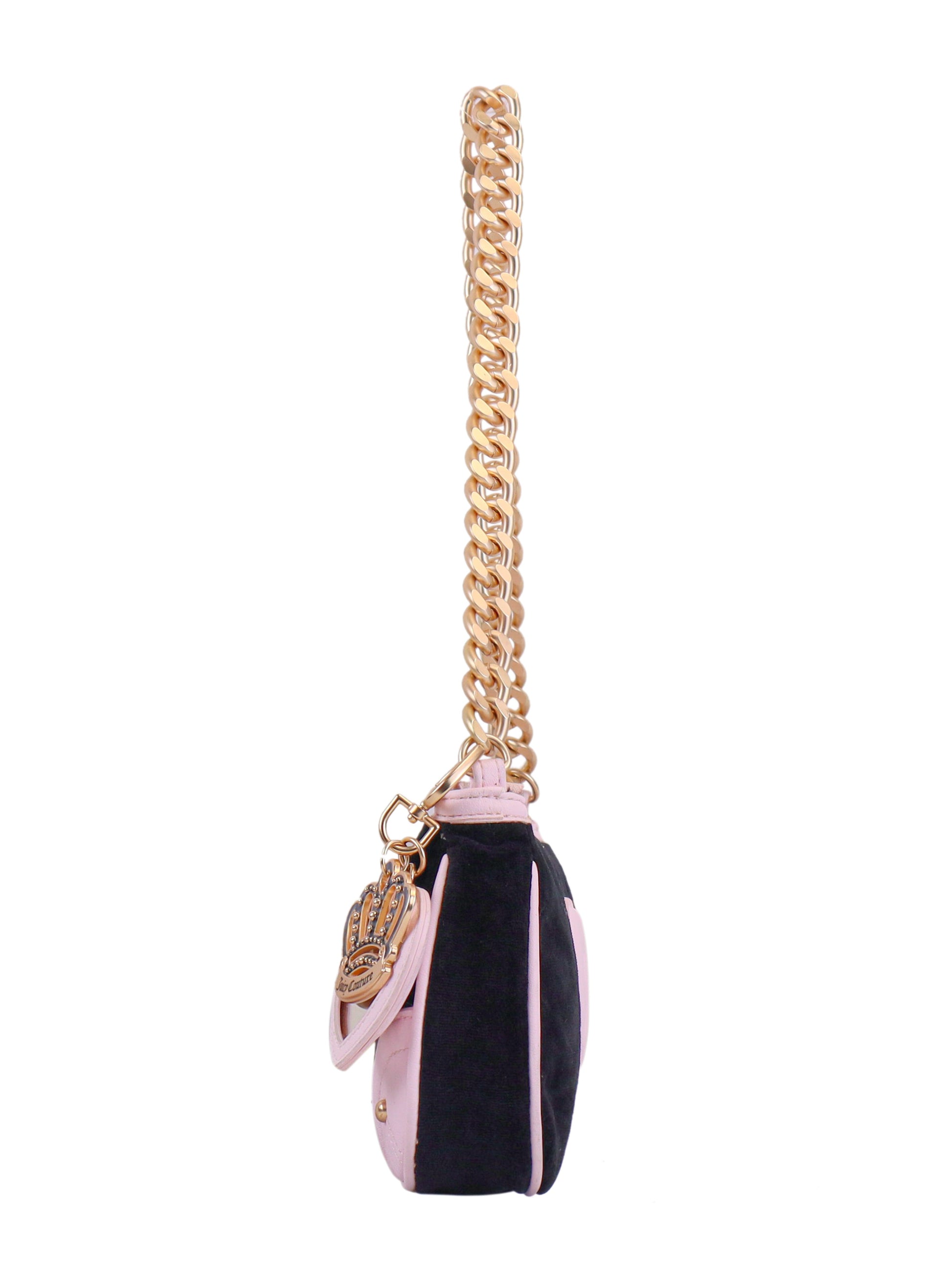 The Royal Bloom Shoulder Bag features a thick gold chain strap, black and light pink panels, and a hand-shaped charm with detailed designs—perfect for adding timeless glamour to any outfit.