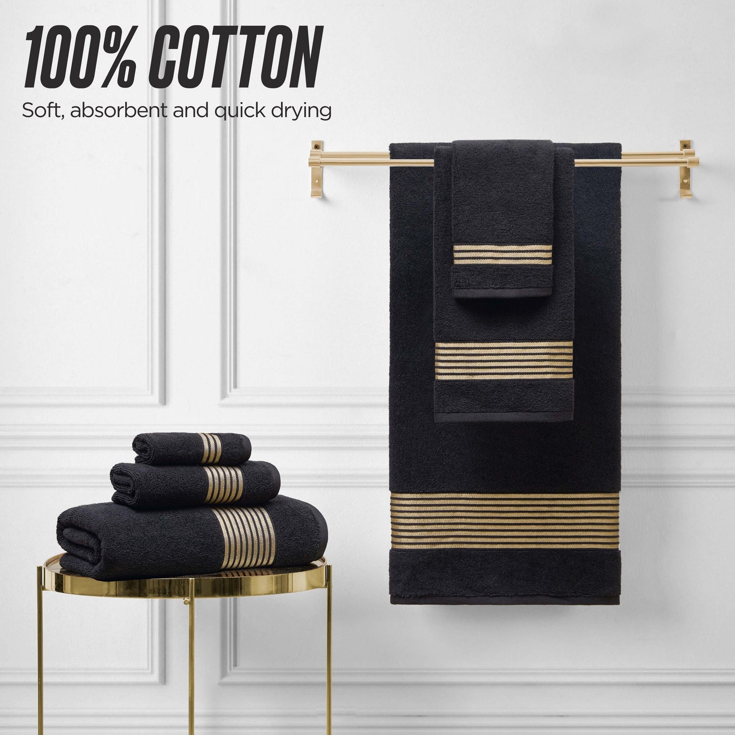 The Melissa Bath Towel Set, crafted from 100% cotton with a zero-twist weave for extra softness, absorbency, and quick drying, is displayed on a gold table and rack; some towels are folded while others are hanging.