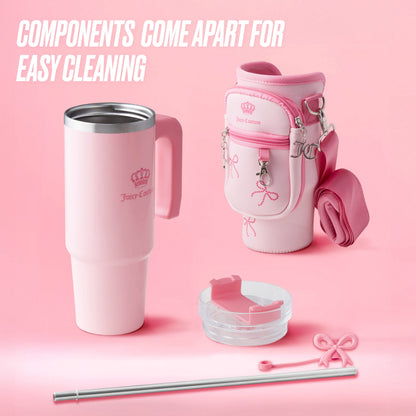 The Jetsetter Hydration Stainless Steel Tumbler features a handle, pink bow charms, clear lid, reusable straw, cleaning brush, and a matching neoprene crossbody pouch. Components come apart for easy cleaning.