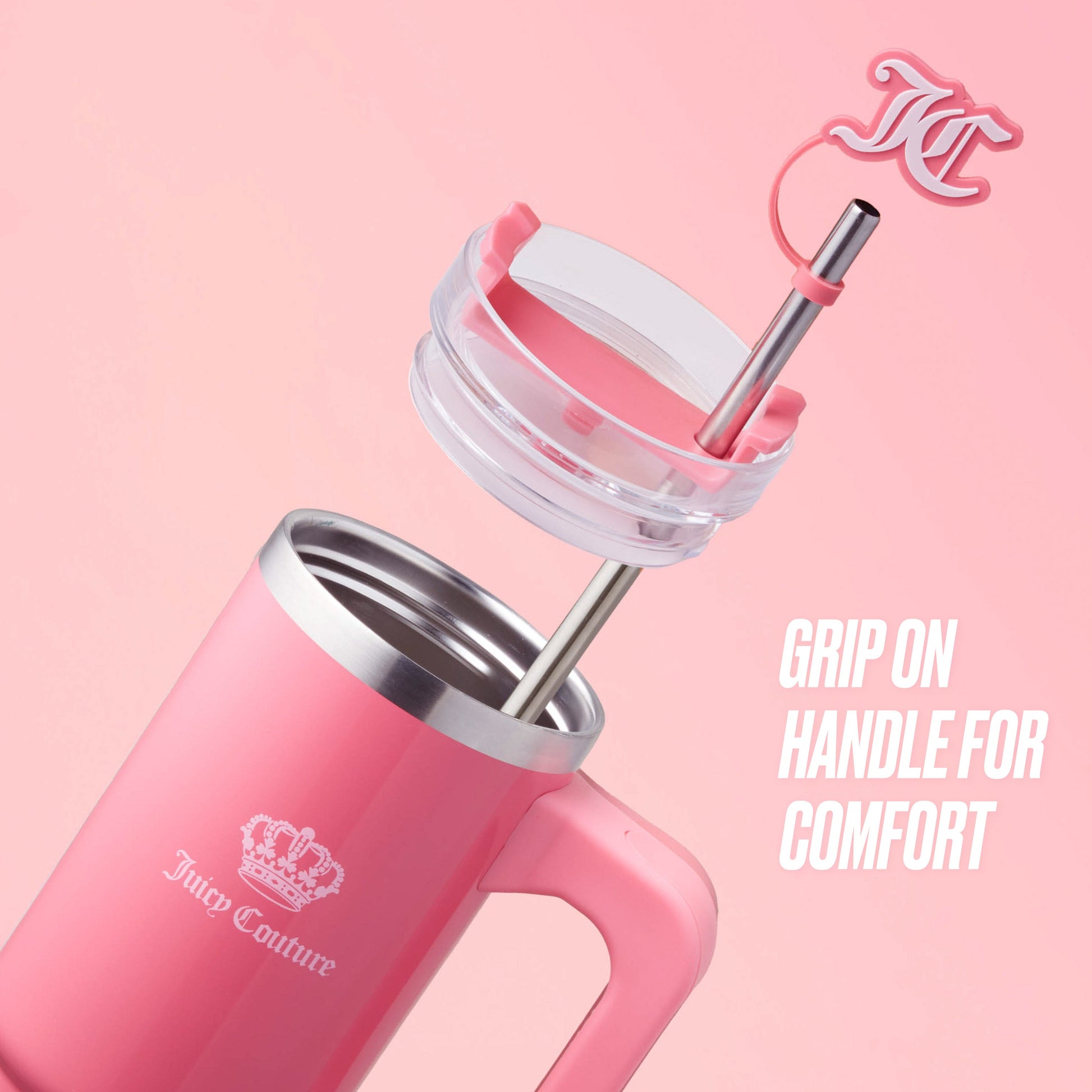 The Jetsetter Hydration Stainless Steel Tumbler with Neoprene Crossbody Pouch is pink with a silver straw, clear lid, and pink handle. It features a slightly open lid, pink logo charm on the straw, and "GRIP ON HANDLE FOR COMFORT" text.