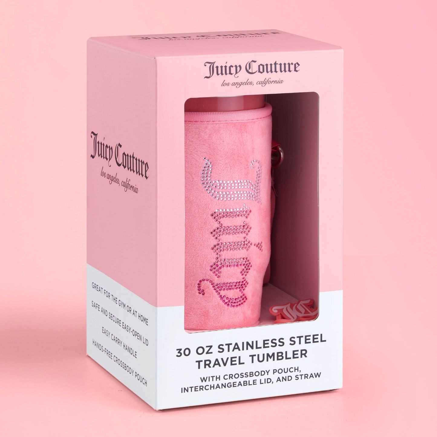 The Jetsetter Hydration Stainless Steel Tumbler with Neoprene Crossbody Pouch comes in a pink box with product details and a clear window showcasing the tumbler, crossbody pouch, interchangeable lid, and straw.