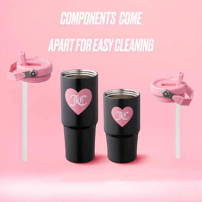 Two Flip Flow Hydration Stainless Steel Tumbler Cups (black, pink heart logo) with two pink lids and straws are displayed on a pink background. Text above: “Components come apart for easy cleaning—perfect mommy and me gift set.”.