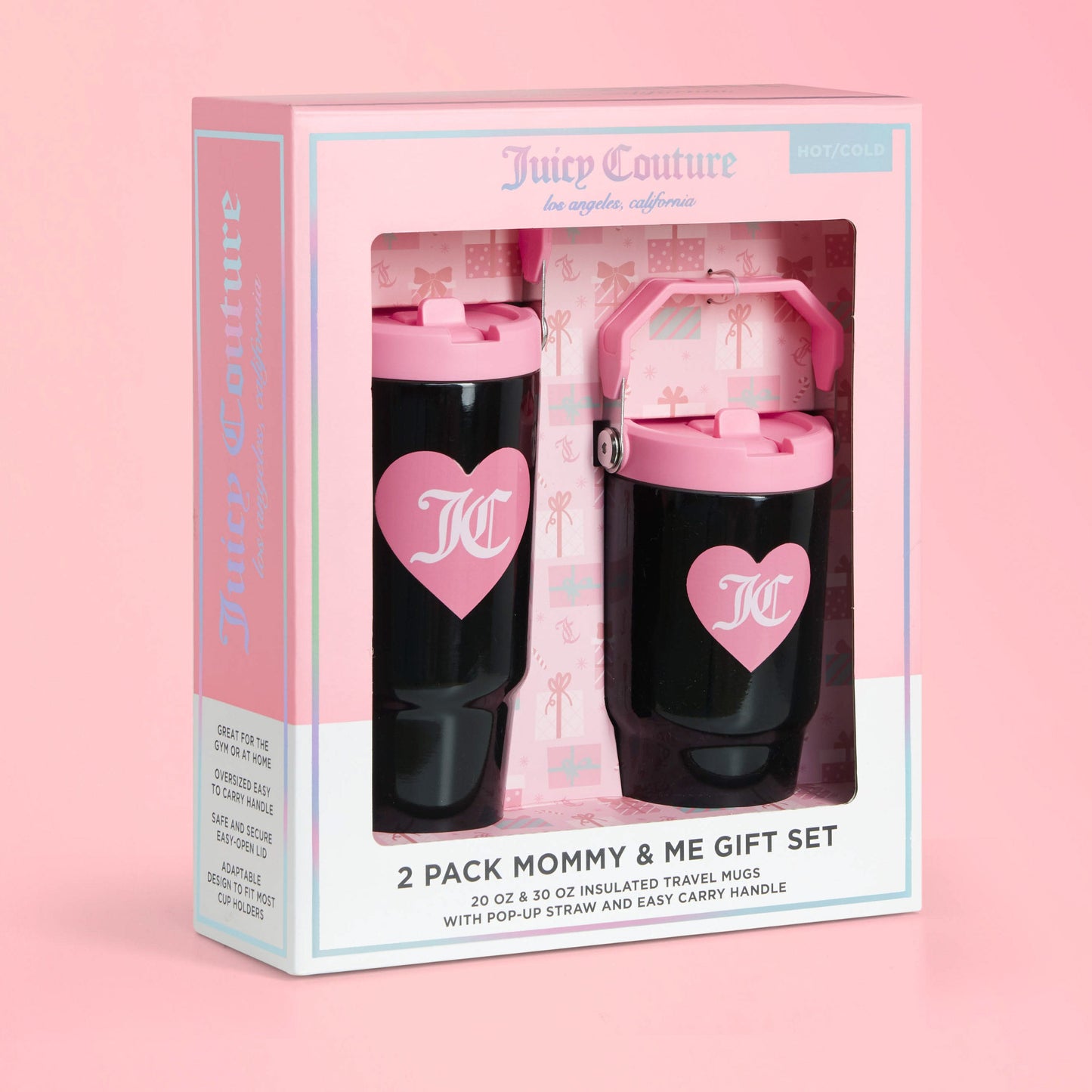 A boxed Flip Flow Hydration Stainless Steel Tumbler Cup 2-Pack, featuring two black insulated mugs with pink lids, handles, and heart logos, is displayed against a pink background. Packaging highlights their hot/cold insulation.