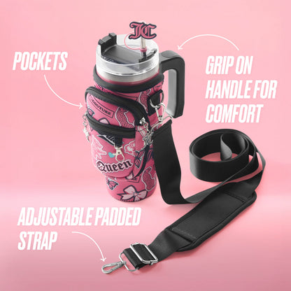 The Jetsetter Hydration Stainless Steel Tumbler with Neoprene Crossbody Pouch is a pink Juicy Couture water jug featuring floral patterns, "Queen" text, pockets, a comfortable grip handle, and an adjustable padded strap.