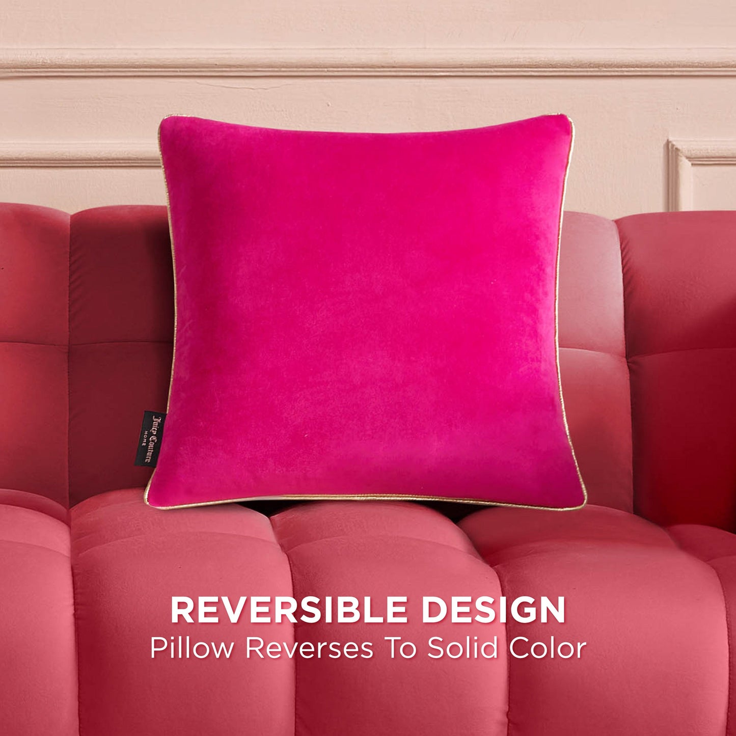 The Velvet Cheetah Square Pillow, featuring a bright pink reversible design and chic cheetah applique, is displayed on a matching tufted sofa. Text reads: Reversible Design – Pillow reverses to solid color.