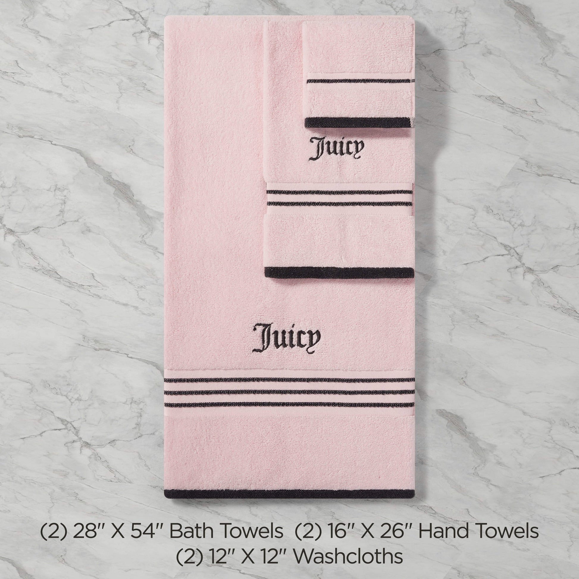 The Neon Border Bath Towel Set features two plush pink bath towels, two hand towels, and two washcloths with black stripes and "Juicy" embroidered in black, shown on a marble background with sizes detailed below.