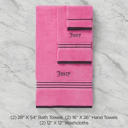 The Neon Border Bath Towel Set includes two pink bath towels, two hand towels, and two washcloths with black stripes and Juicy embroidery, all arranged on a light marble surface. Sizes listed below.