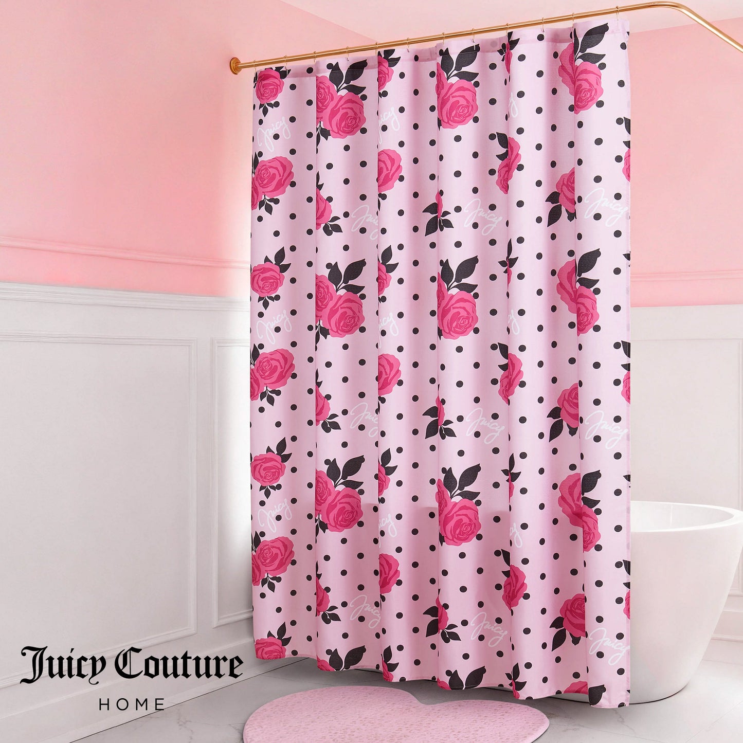A pink bathroom features a bathtub and a Shower Curtain and Hooks Set decorated with pink roses and black polka dots; a pink heart-shaped rug lies on the floor.
