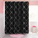 A pink and white bathroom features a Shower Curtain and Hooks Set with a white bow and monogram print, a pink heart-shaped rug, folded towels, and a window that lets in natural light.
