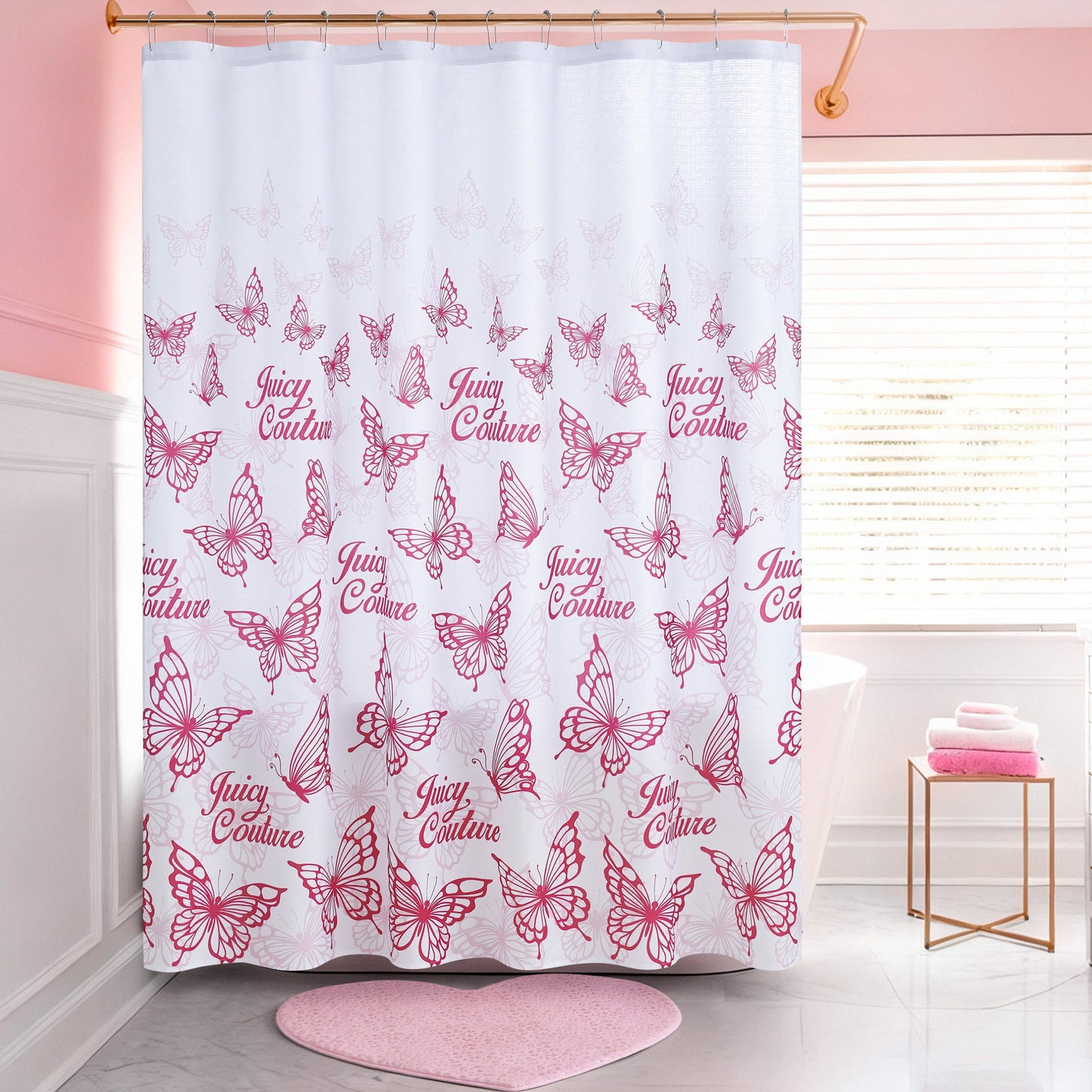 The Shower Curtain and Hooks Set features white fabric with pink butterfly outlines and "Juicy Couture" in pink, making it a stylish addition to bathrooms with pink and white decor.
