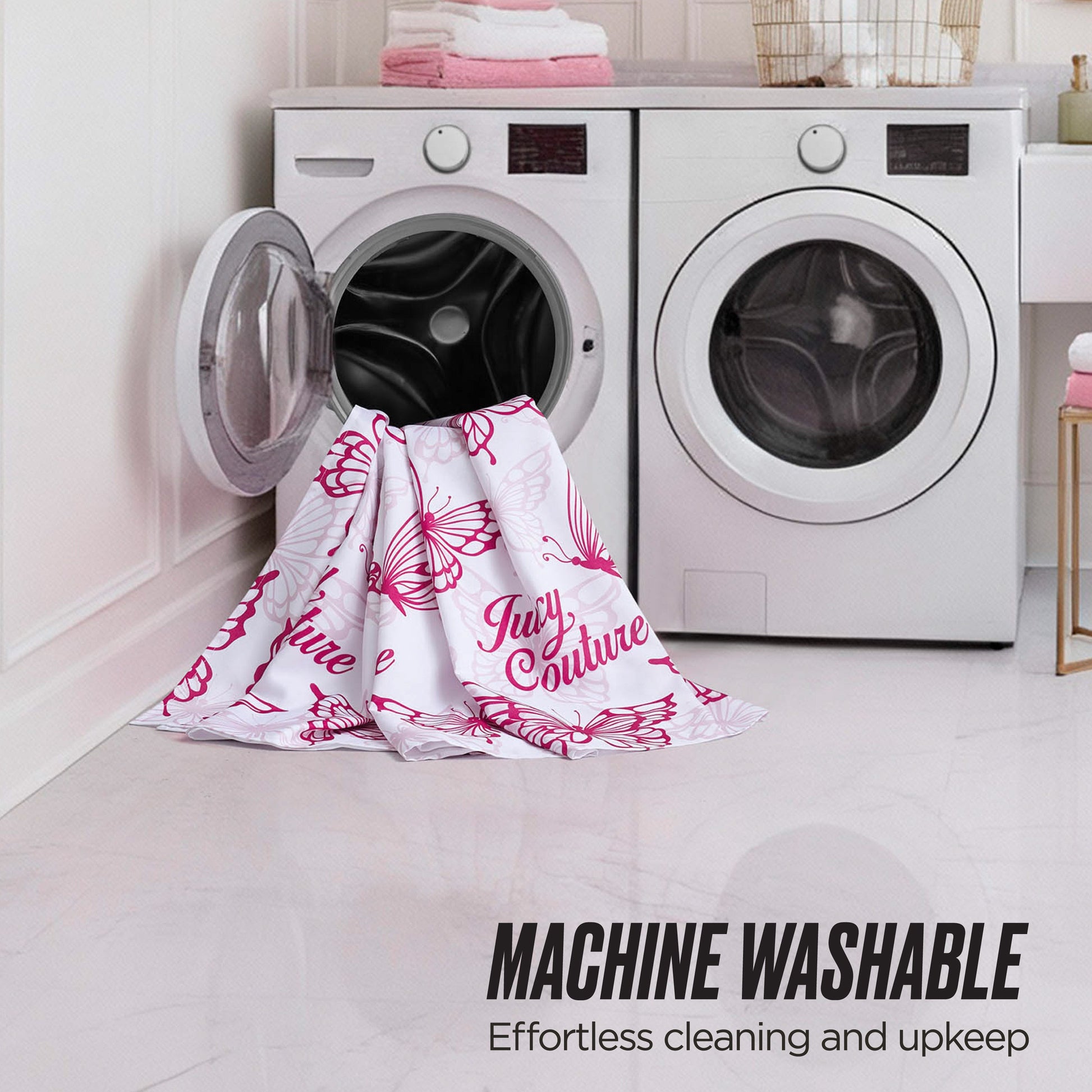 A white and pink shower curtain from the Juicy Couture Shower Curtain and Hooks Set hangs partly in and out of a front-loading washer, next to a dryer. Text: MACHINE WASHABLE—Effortless cleaning, just like your favorite Juicy Couture set.