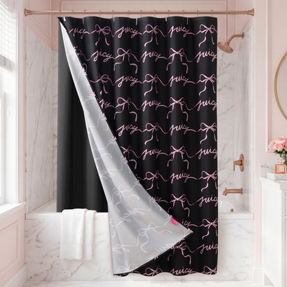 The Sweet Bow Shower Curtain with PEVA Liner and Hooks 14-Piece Set features a black design accented with pink bows and the word "juicy" in cursive, partially pulled back in a white and gold marble bathroom with a bathtub, towel, and gold shower fixtures—a true statement piece that elevates your bath decor.