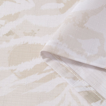 Close-up of the Stassi Shower Curtain with PEVA Liner and Hooks 14-Piece Set, featuring beige and white fabric with a subtle abstract pattern. The fabric is folded to highlight its texture and neatly stitched edges—perfect for elevating your bath decor or making a statement in your bathroom ensemble.