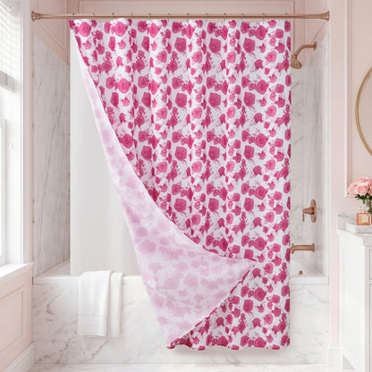 The Larissa Floral Shower Curtain with PEVA Liner and Hooks 14-Piece Set in soft pink and white blooms hangs gracefully in a marble bathroom adorned with rose gold fixtures. A bouquet of pink flowers on the counter enhances the stylish bath decor, while a white towel is neatly draped nearby.