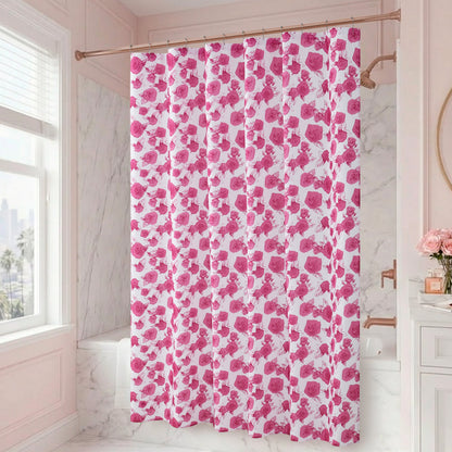 A bathroom with marble walls and a window features the Larissa Floral Shower Curtain with PEVA Liner and Hooks 14-Piece Set in pink and white with a floral pattern, making it a true statement shower curtain. A round mirror, flowers in a vase, and a sink are visible on the right side of the image, enhancing the elegant bath decor.