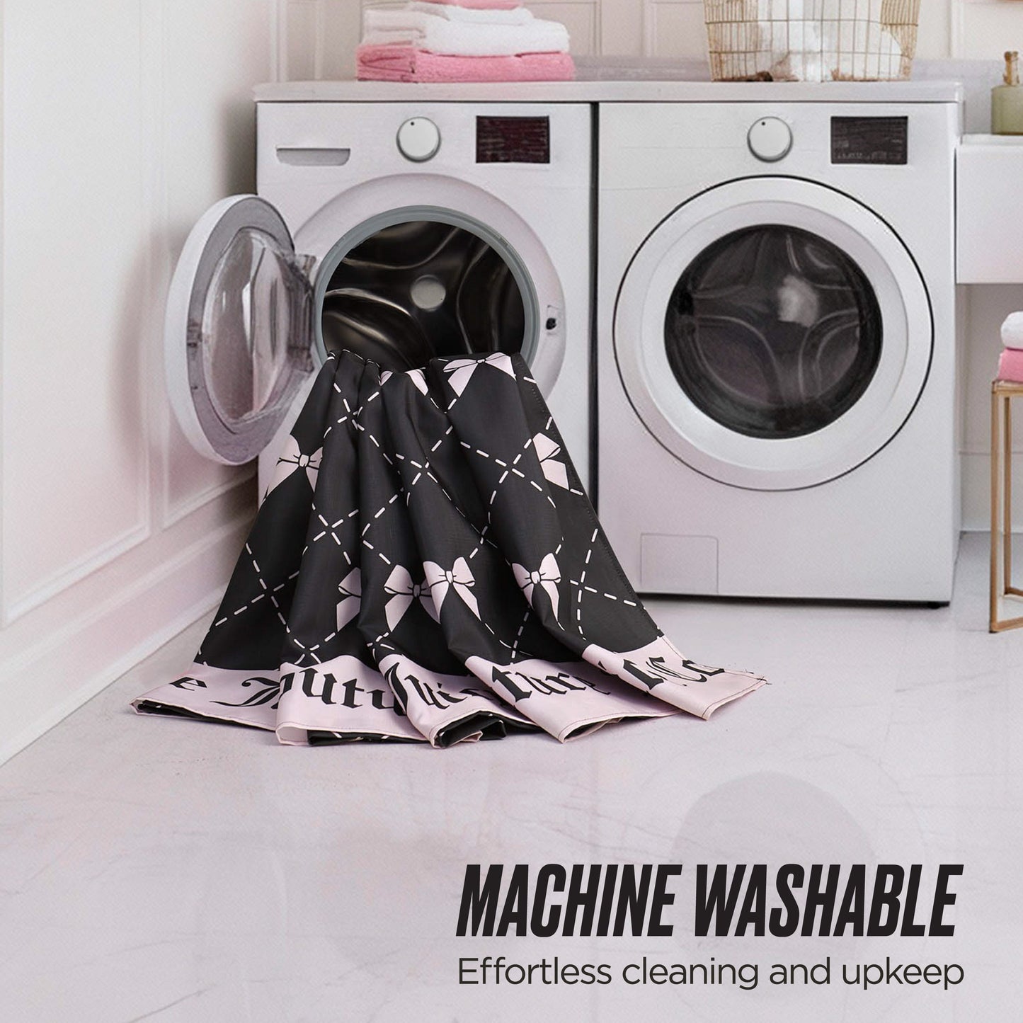 A black and pink patterned Shower Curtain and Hooks Set is partially inside an open front-loading washing machine in a laundry room. Text reads: Machine Washable—Effortless to clean, great for matching your bathroom decor.