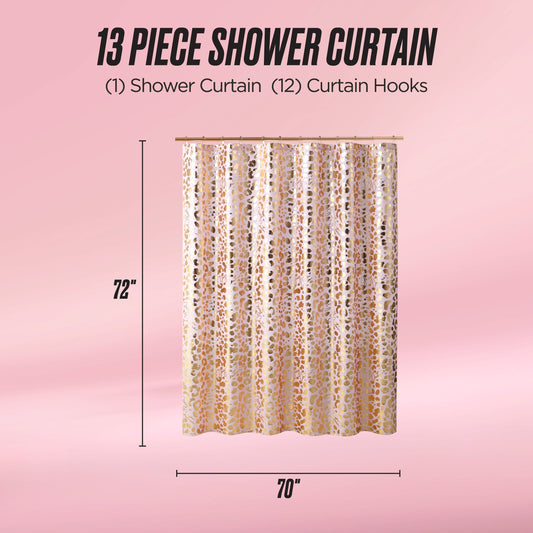 The Shower Curtain and Hooks Set features a gold and white pattern, includes 12 hooks, and measures 72" x 70". Shown against a pink background, this chic 13-piece set is perfect for stylish bathroom decor.