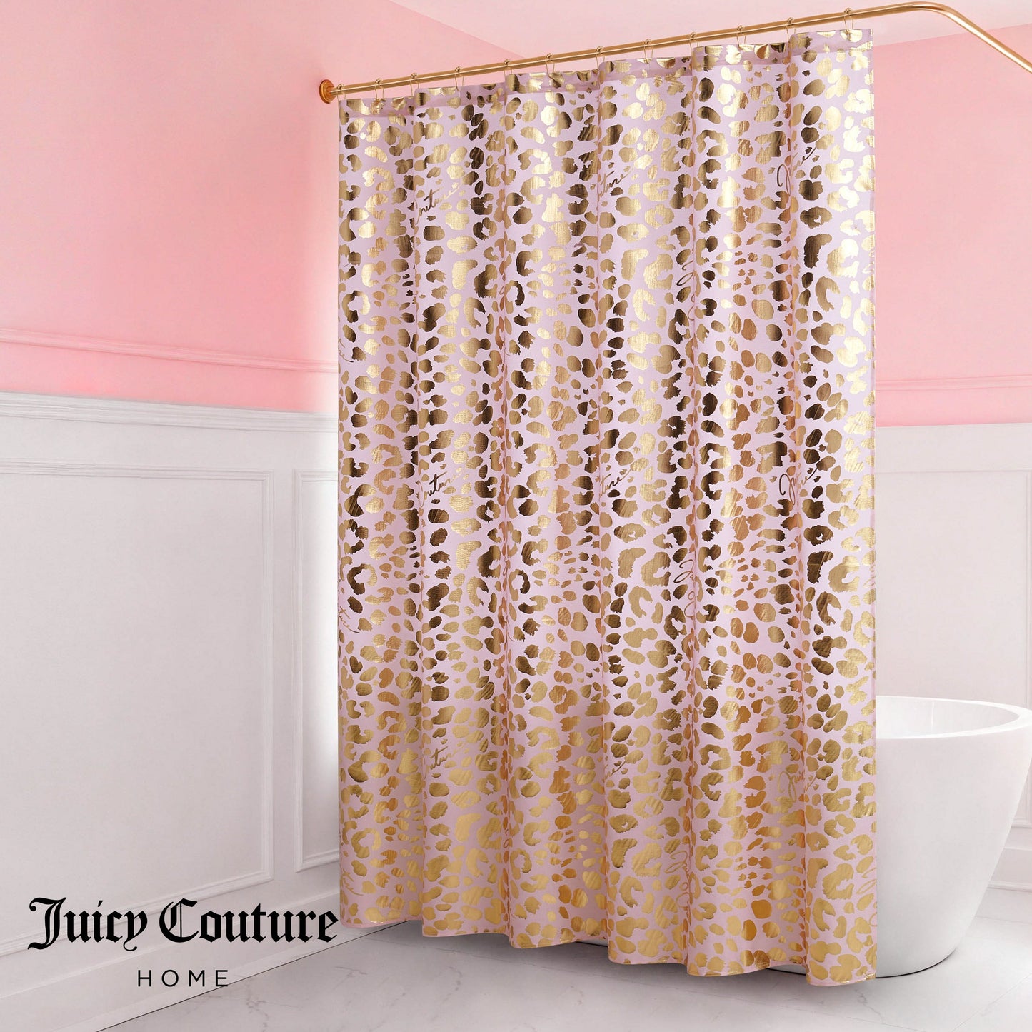 A pink and white bathroom features the Shower Curtain and Hooks Set in a gold and pink animal print, suspended from a curved rod. The Juicy Couture Home logo is displayed in the lower left corner, adding chic style to your decor.