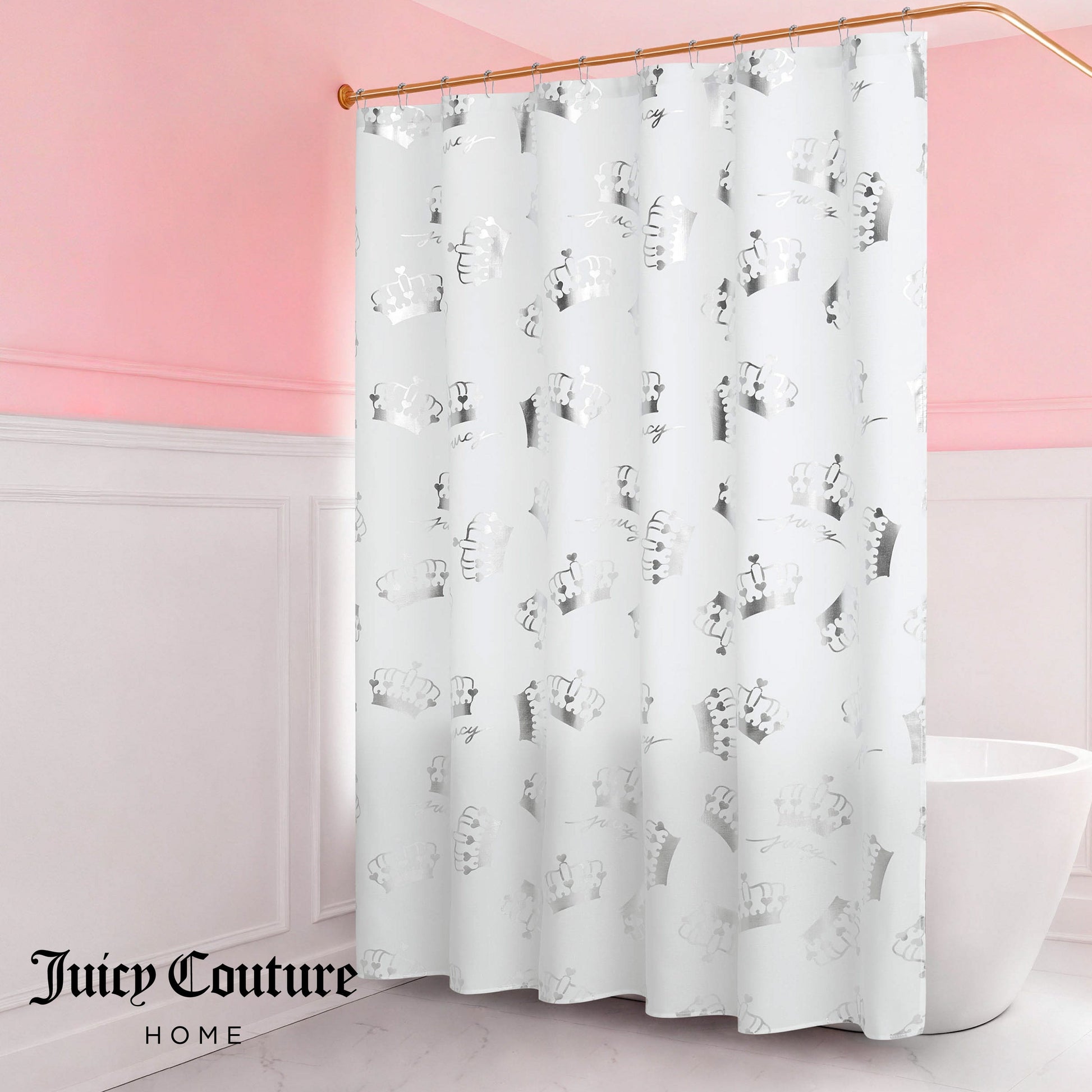 A Shower Curtain and Hooks Set with a gray animal print by Juicy Couture hangs in a bathroom with pink walls and white wainscoting, featuring the Juicy Couture Home logo in the bottom left corner to elevate your decor.