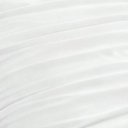 Close-up of the Amelie Bows Ruched Comforter Set shows white fabric with soft, diagonal pleats for a textured, layered look. The ultra-soft material appears smooth, with evenly spaced ruching that adds elegance to your bedding.