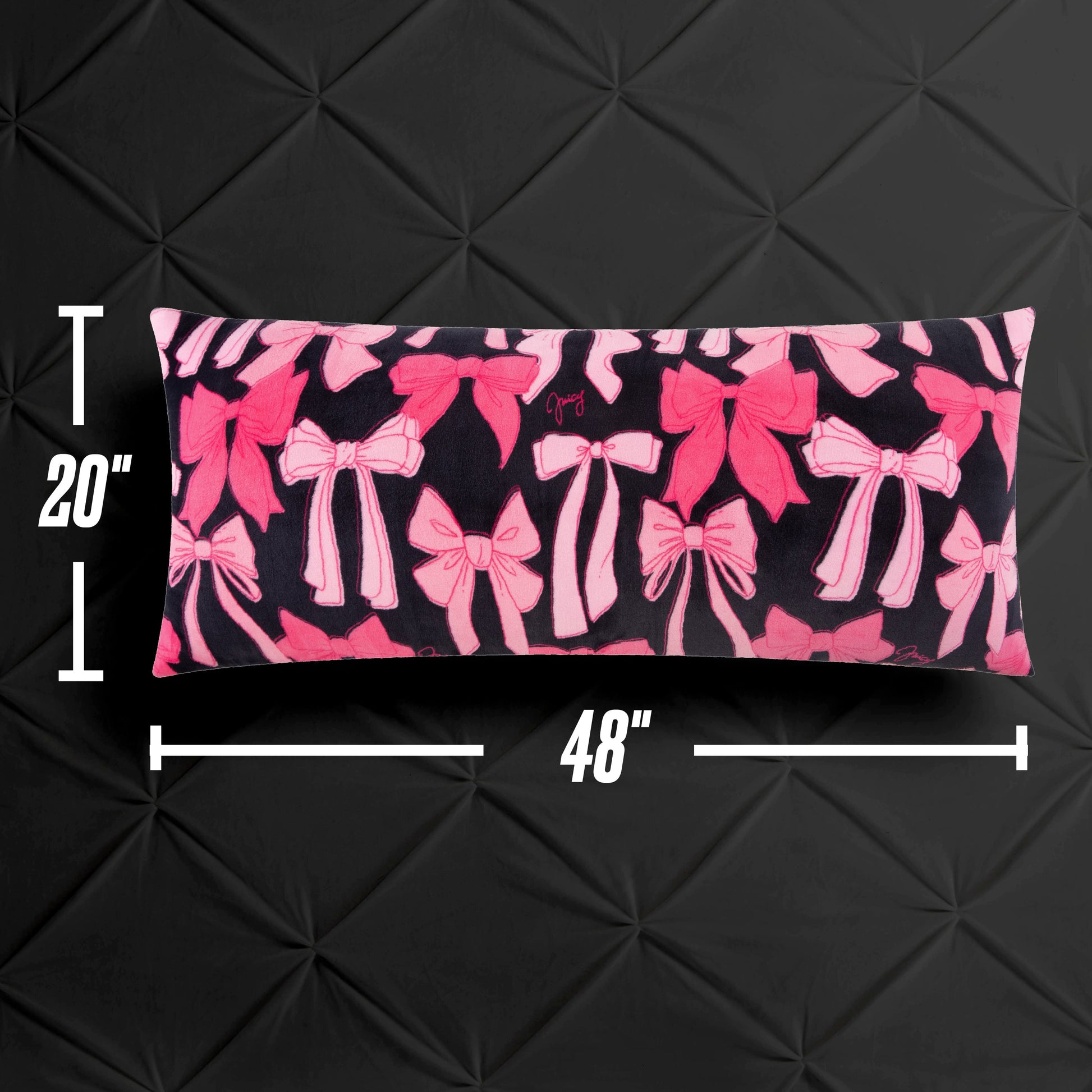 The Plush Body Pillow, featuring a pink bow pattern on black and measuring 20"x48", is shown against a black textured backdrop with measurement markers along the sides.