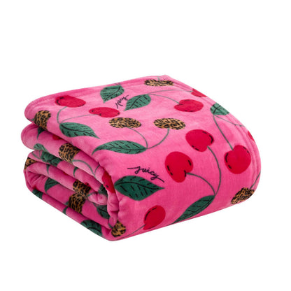 The Plush Oversized Throw Blanket features a folded pink design with red cherry and green leaf patterns, leopard print accents, and "juicy" in script—an ultra-soft choice for cozying up in style.