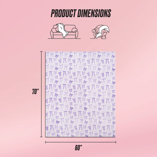 A Plush Oversized Throw Blanket by Juicy Couture, featuring a purple animal pattern, measures 70"x60". Pictured on a pink background with icons for couch or wrap use. The text reads "Product Dimensions.