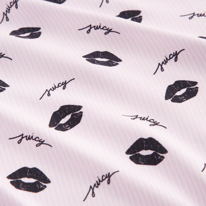 The Printed Microfiber Sheet Set features white fabric with light pink stripes, black lip prints, and “juicy” in cursive—adding playful charm and style to your bedding collection.