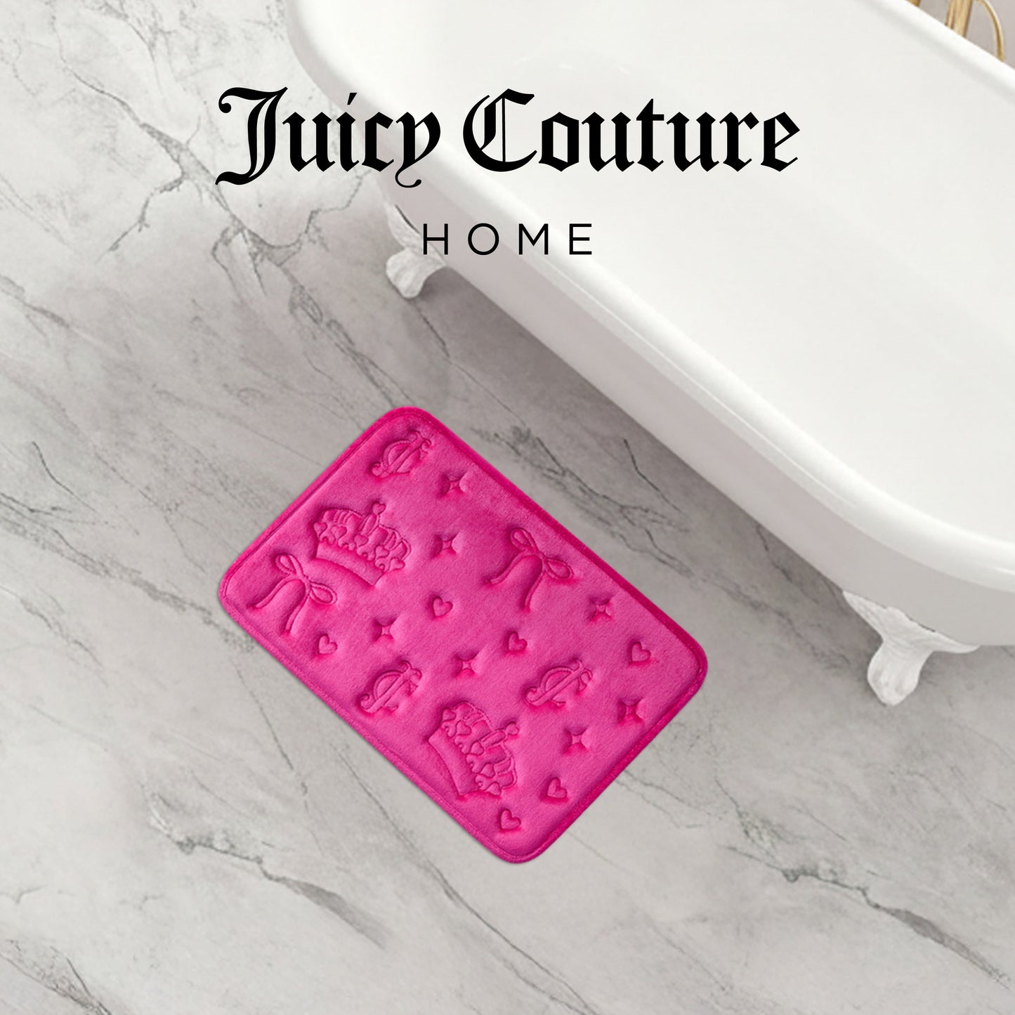 A Quilted Memory Foam Bath Mat in bright pink with embossed crowns, bows, and hearts lies on a marble floor beside a white clawfoot tub, adding comfort and glamour to any bathroom.