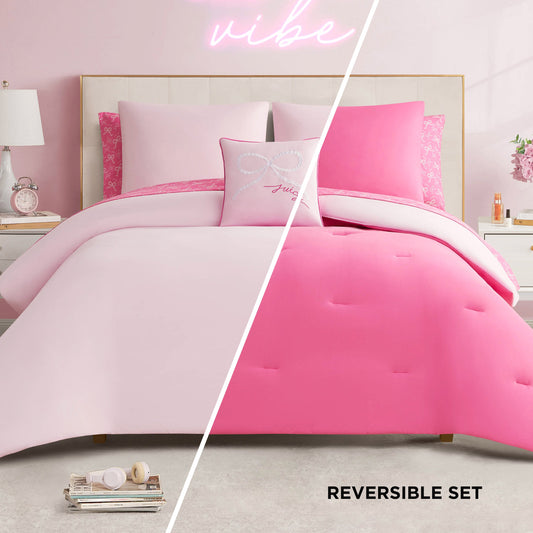 A designer-inspired bedroom features the Pearly Bows Reversible Bed in a Bag Bedding Set with a light and hot pink comforter, accented by decorative pillows and a neon vibe sign for added flair in the soft pink and white space.