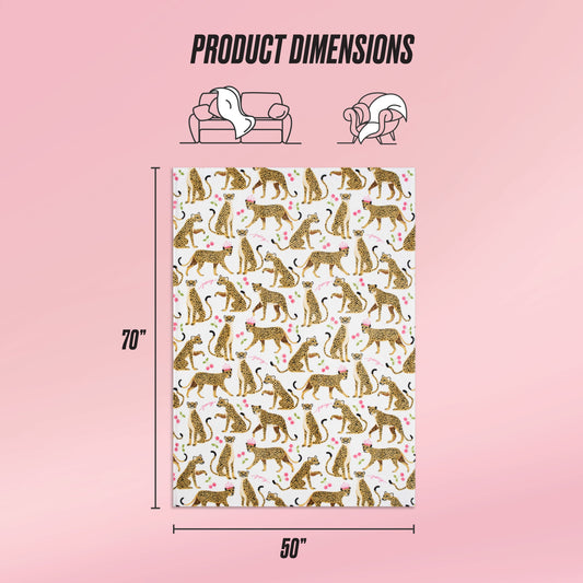 The Kids Plush Throw Blanket, measuring 70x50 inches, features illustrated cheetahs and pink hearts. Icons show its ultra-soft use on a sofa and wrapped around a person. Text highlights: PRODUCT DIMENSIONS.