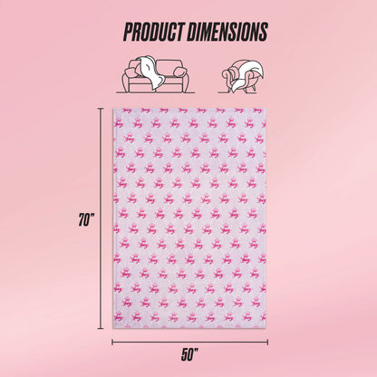A pink background displays the Kids Plush Throw Blanket by Juicy Couture, measuring 70x50 inches with a pink pattern. Icons illustrate its use on a couch and over shoulders, with “Product Dimensions” written above.